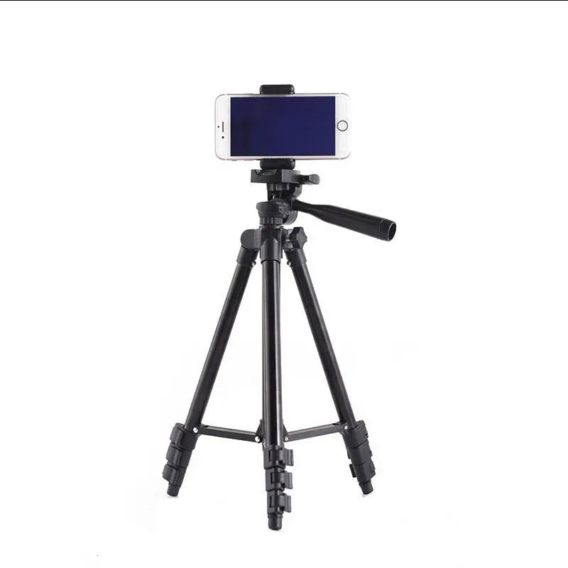 Black aluminium camera tripod with 3D head and four-section legs extended to maximum height