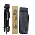 Black aluminium camera tripod with 3D head and four-section legs extended to maximum height
