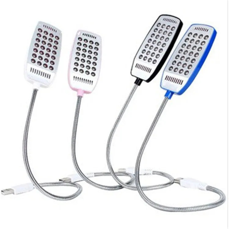 Flexible gooseneck USB LED lamp in multiple colours on a desk next to a laptop