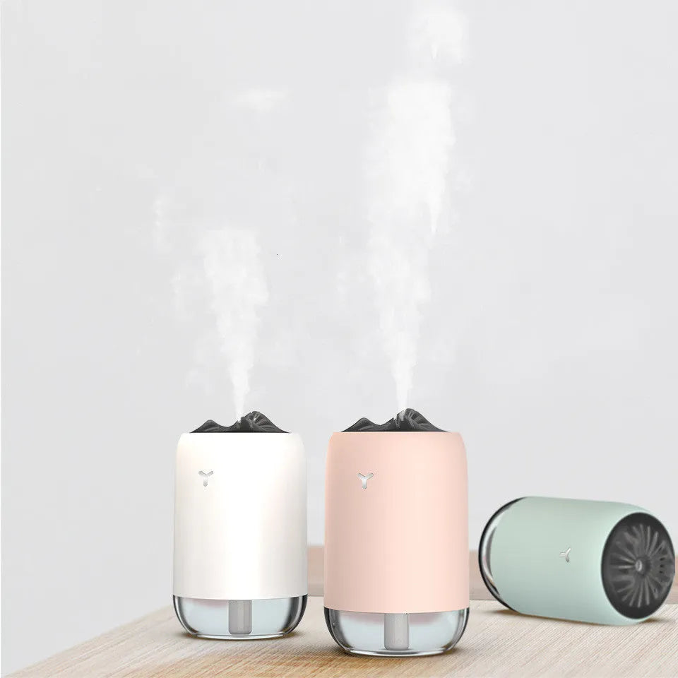 White columnar desktop humidifier with ultrasonic mist function and USB power cable