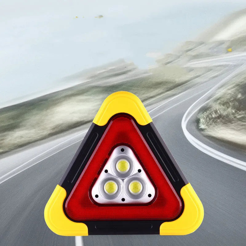 Car warning triangle with solar light and LED work light on roadside