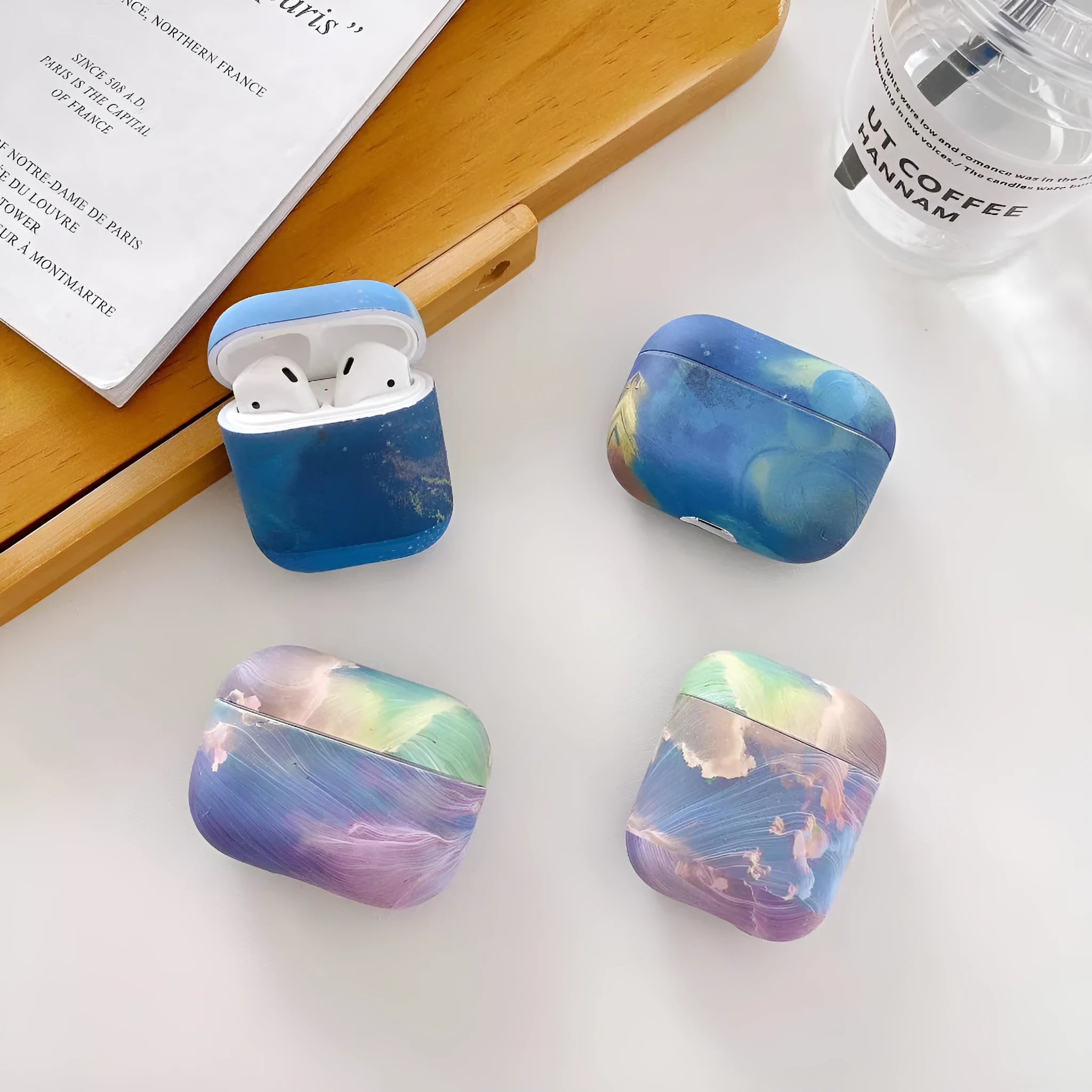 Pink watercolour hard plastic protective case for Apple AirPods with visible decorative pattern