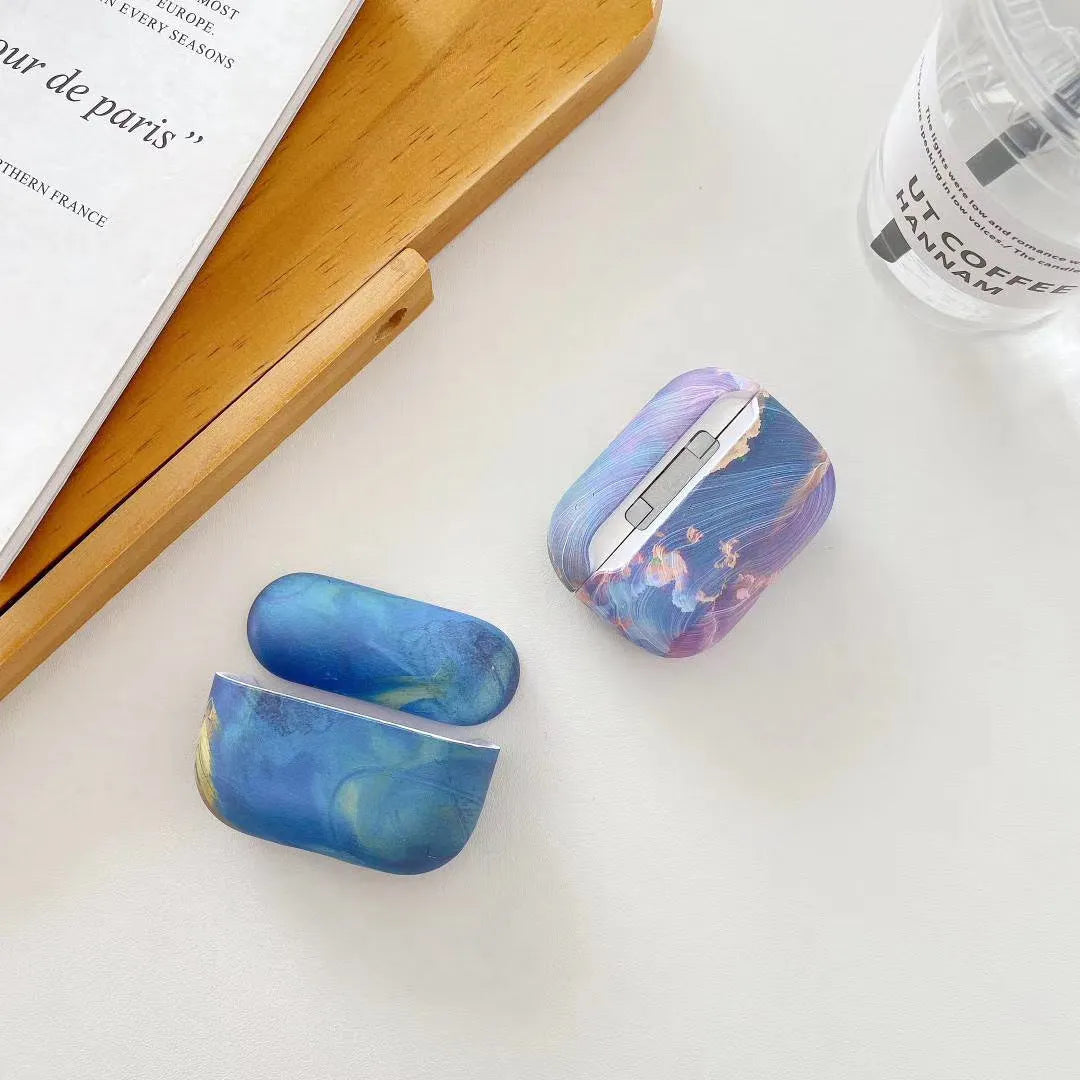 Pink watercolour hard plastic protective case for Apple AirPods with visible decorative pattern