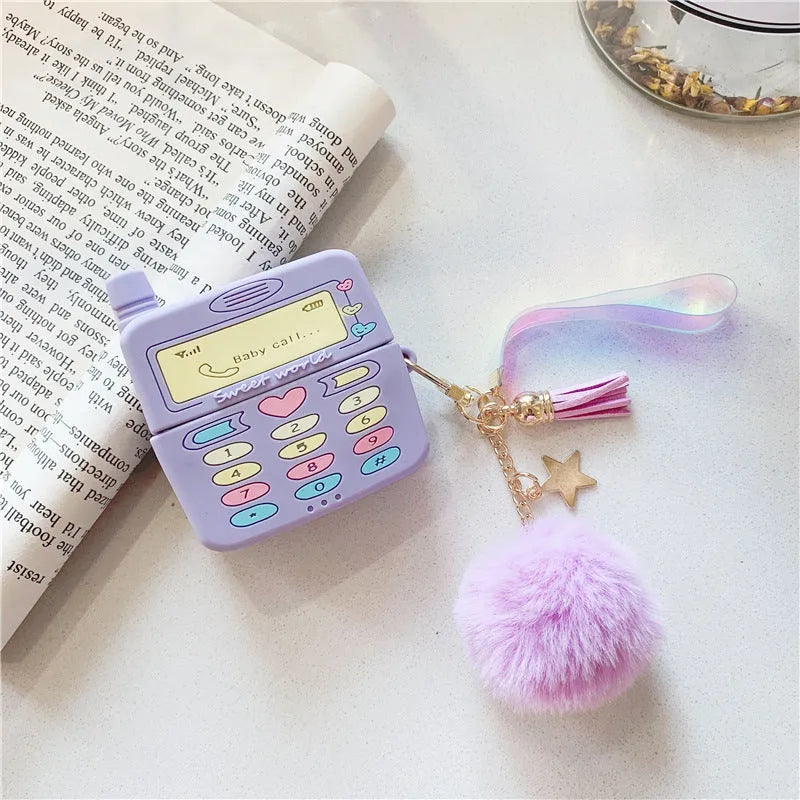 Purple silicone AirPods protective case with fluffy fur ball pendant attached