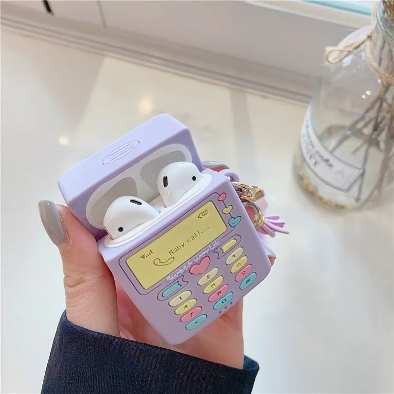 Purple silicone AirPods protective case with fluffy fur ball pendant attached