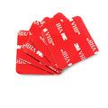 Round red PU foam double sided adhesive tape pads in various sizes on a white background