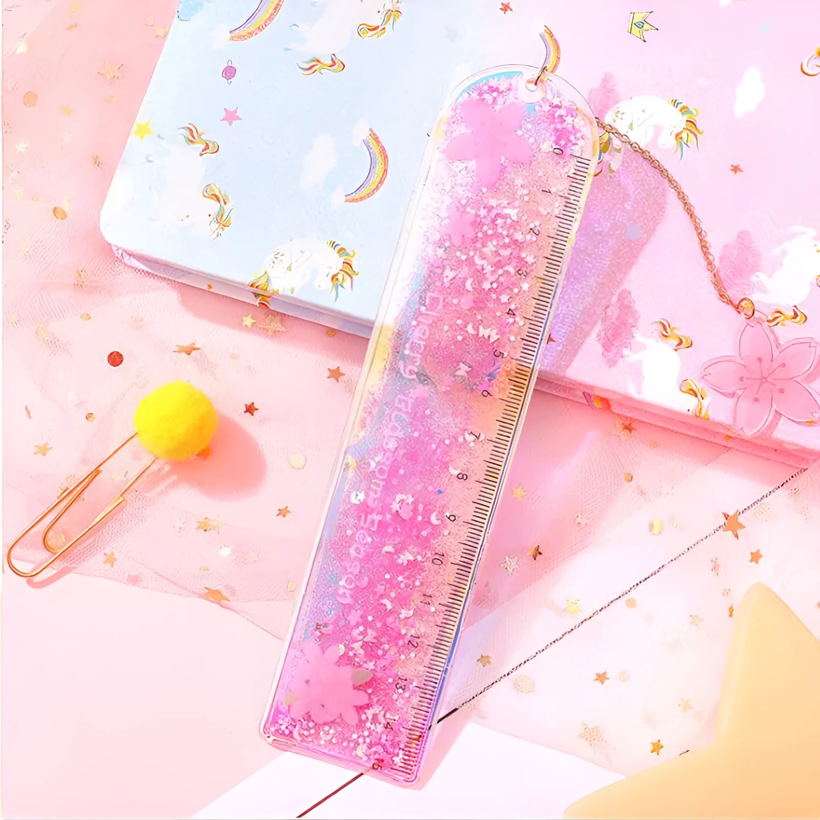 15cm quicksand oil bookmark ruler in laser PVC with cherry blossom pattern on a desk