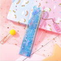 15cm quicksand oil bookmark ruler in laser PVC with cherry blossom pattern on a desk