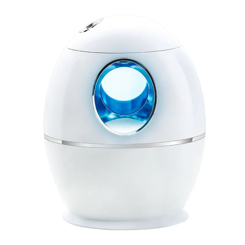 White round aromatherapy humidifier with USB cable and water tank showing mist output