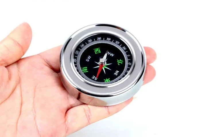Stainless steel handheld compass for outdoor hiking and camping, white model with brushed metal body and polished base