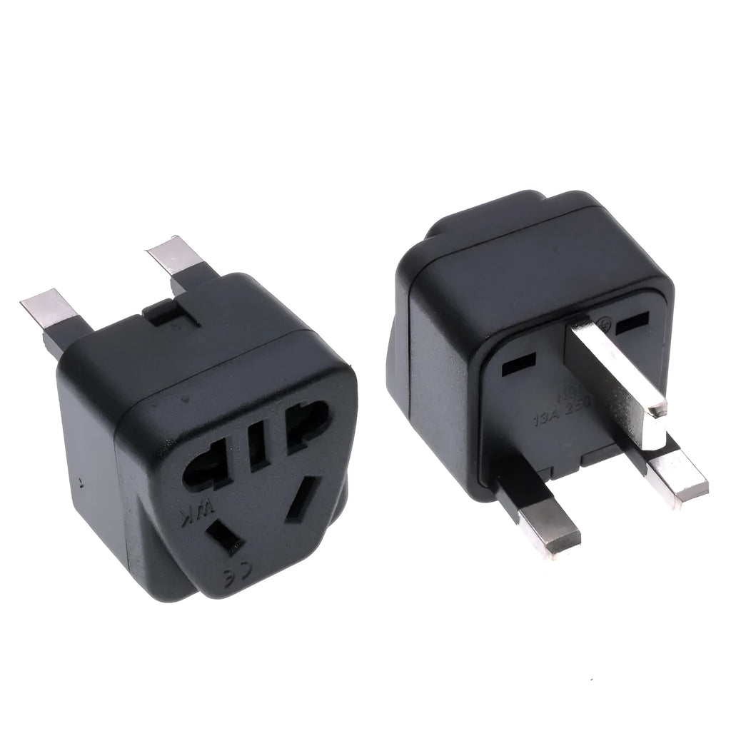 Square white and black international power adapter plug with three pins and five output sockets.