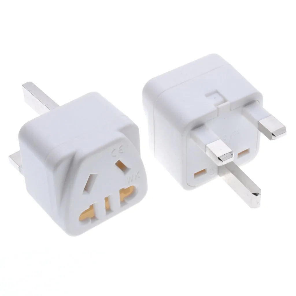 Square white and black international power adapter plug with three pins and five output sockets.