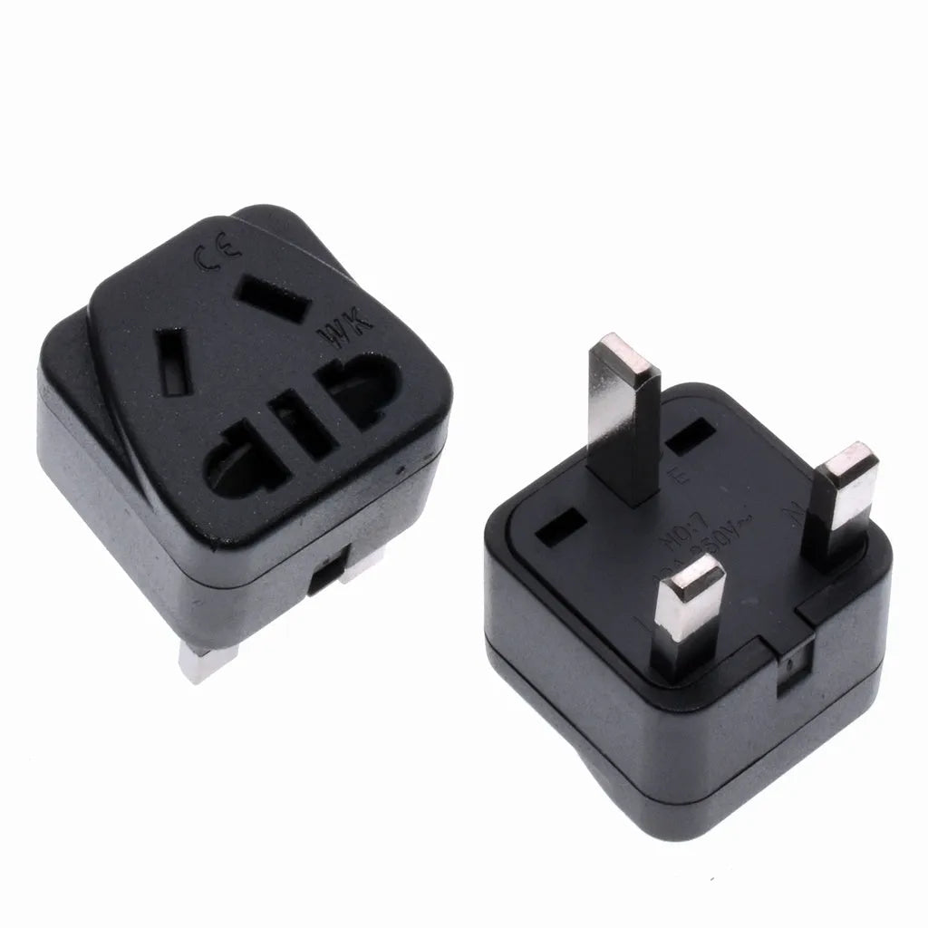 Square white and black international power adapter plug with three pins and five output sockets.