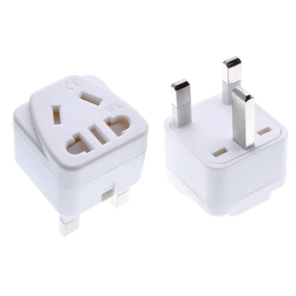 Square white and black international power adapter plug with three pins and five output sockets.