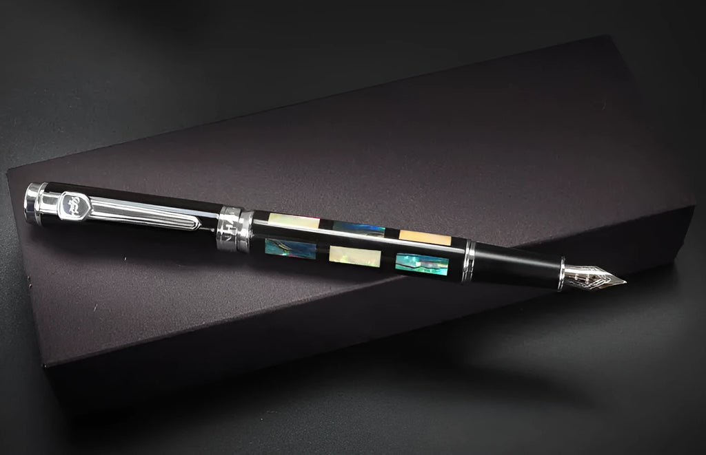 Ceramic colour lacquer pen with metal shell, rotating ink supply, and choice of three nib sizes in peach wood finish