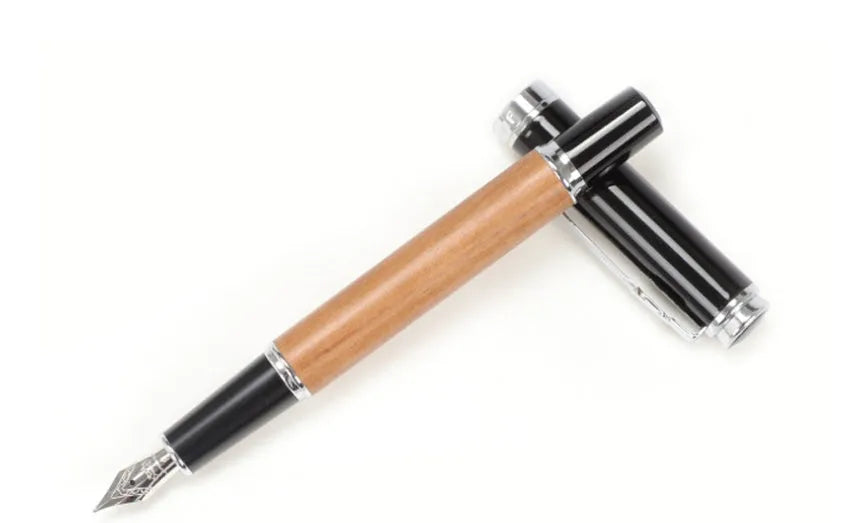 Ceramic colour lacquer pen with metal shell, rotating ink supply, and choice of three nib sizes in peach wood finish