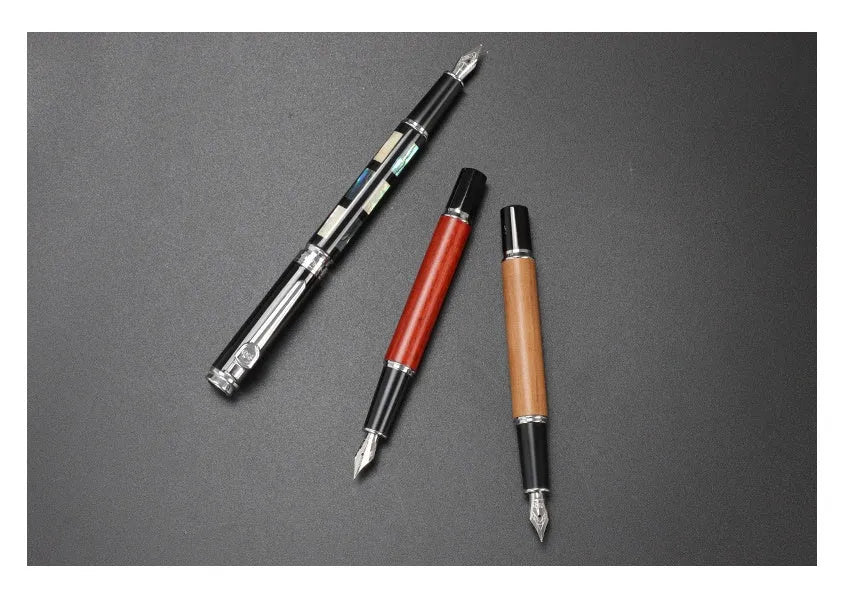 Ceramic colour lacquer pen with metal shell, rotating ink supply, and choice of three nib sizes in peach wood finish