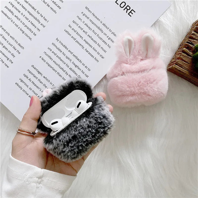 Pink soft silicone AirPods cover with grey plush rabbit ears attached to the top.
