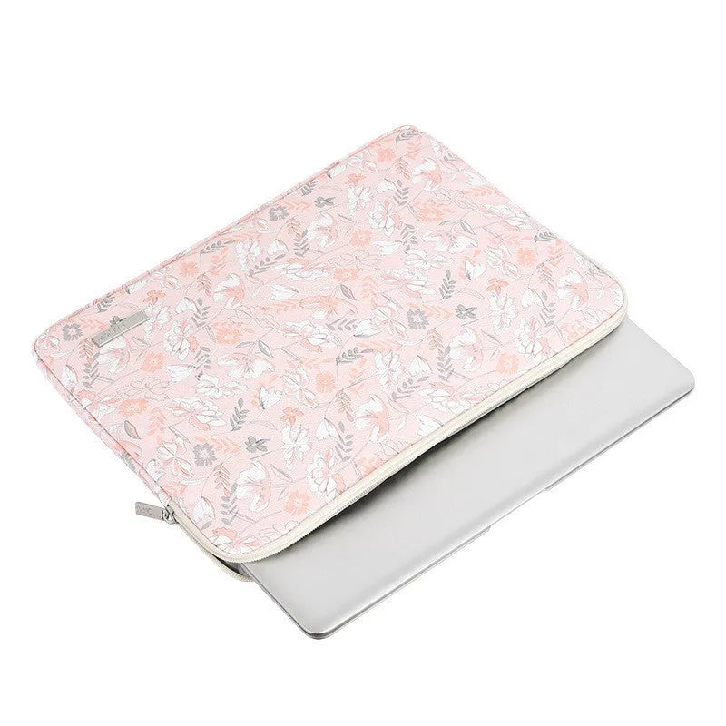 Pink waterproof notebook cover with flower print, zipper closure, and PU leather exterior for 11-15 inch devices
