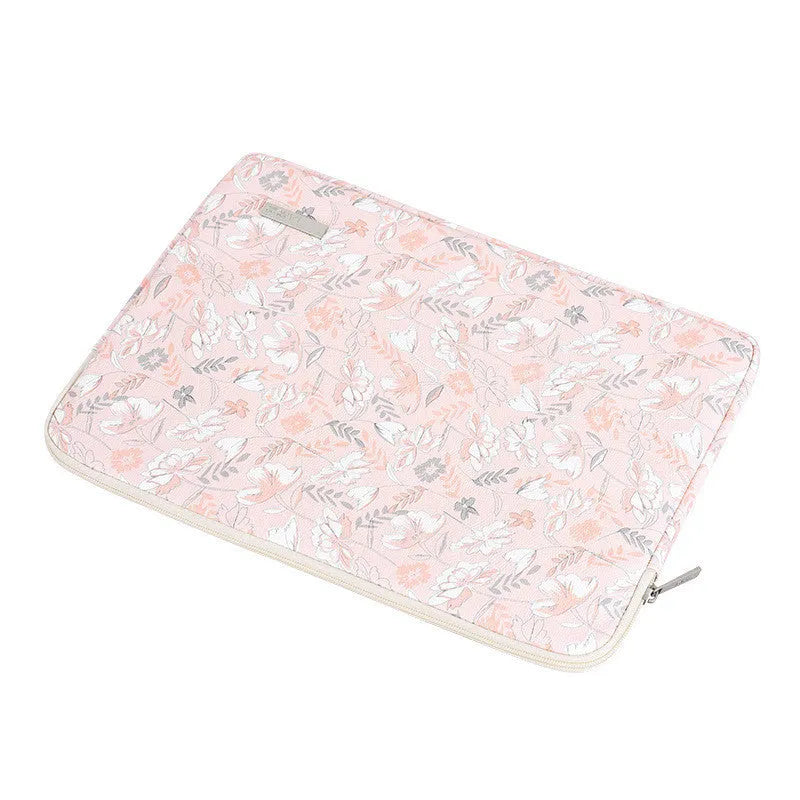 Pink waterproof notebook cover with flower print, zipper closure, and PU leather exterior for 11-15 inch devices