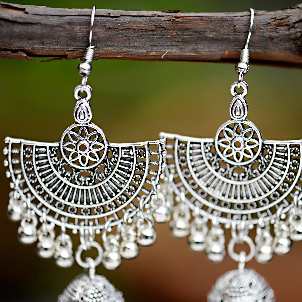 Gold bell tassel earrings with diamond lens centre and alloy inlaid artificial gemstone