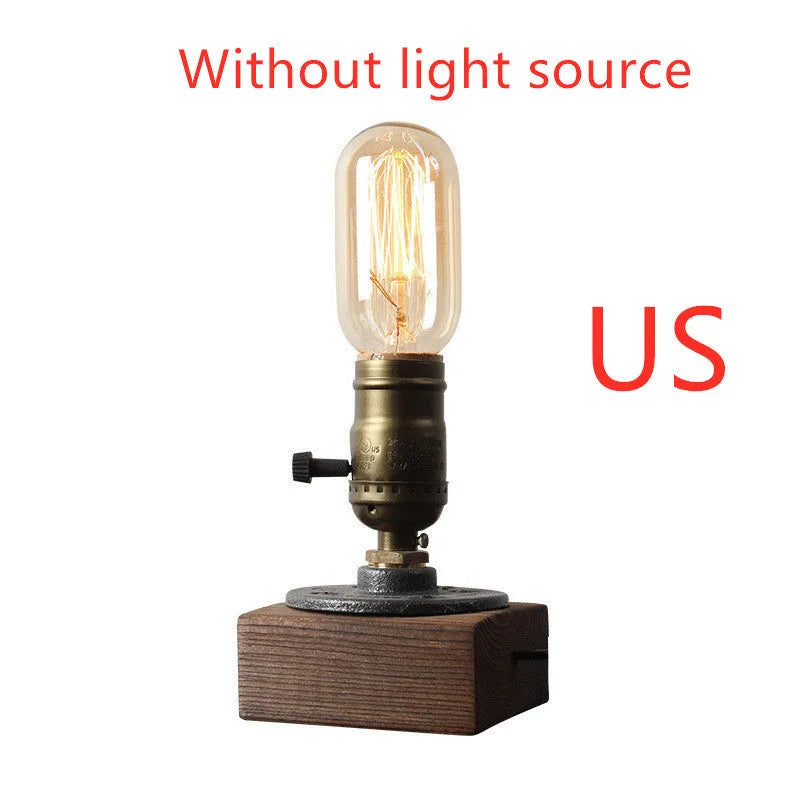 Compact water pipe design table lamp made from wood and iron on a wooden surface.