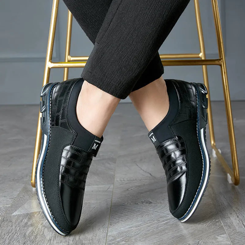 Men's black casual leather shoes with low upper, shown on a size chart background.