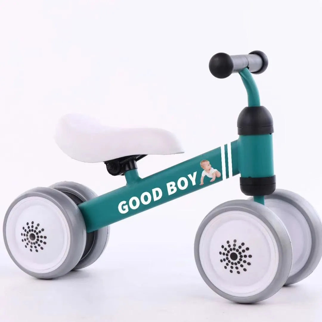 Plastic no-pedal baby balance bike with three wheels, carbon steel frame, EVA foam tyres, and artificial PU leather seat