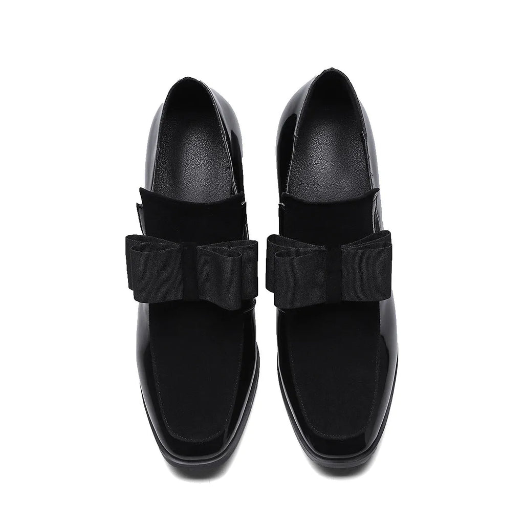 Black patent leather women's high heels with a thick chunky heel and square toe on a rubber sole.