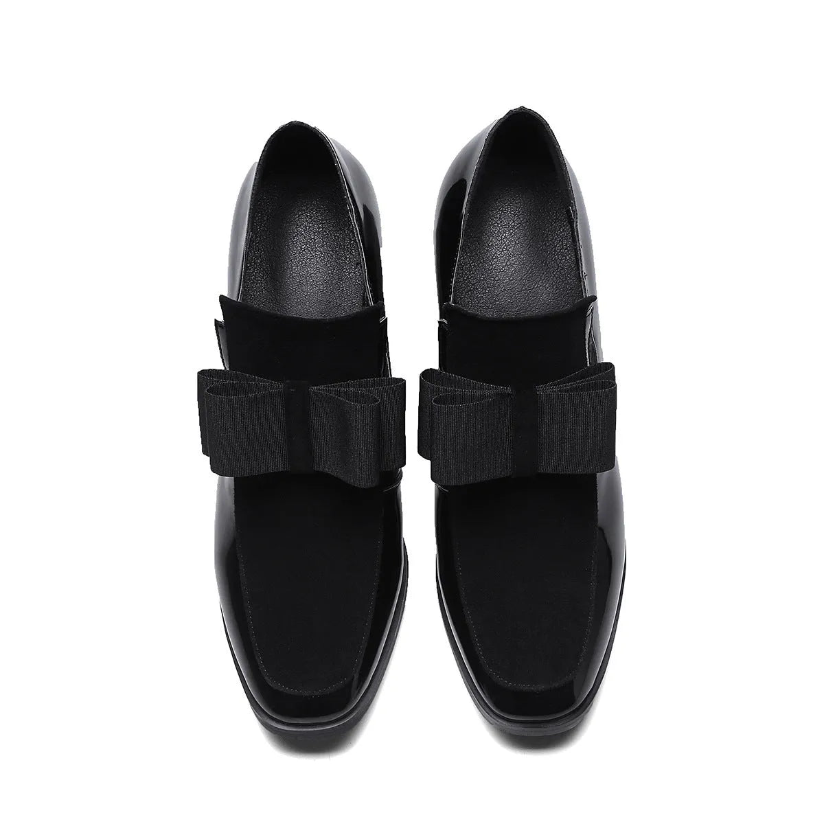 Black patent leather women's high heels with a thick chunky heel and square toe on a rubber sole.
