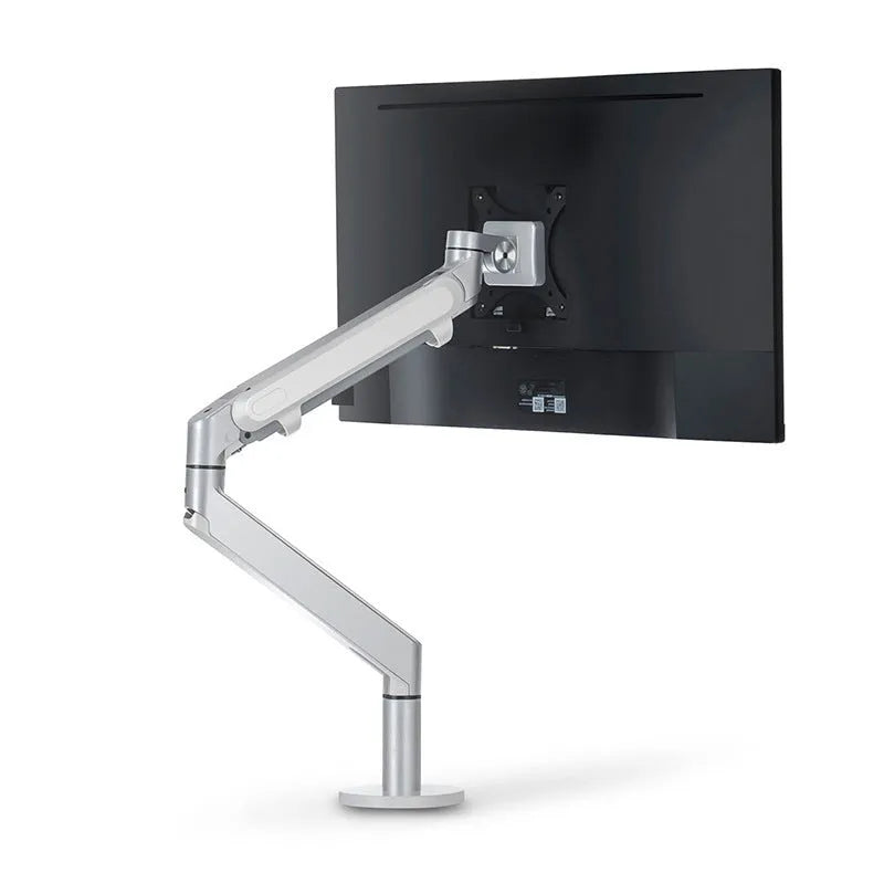 Lifting computer stand in dark grey with a monitor placed on top, shown on a desk for ergonomic viewing height.
