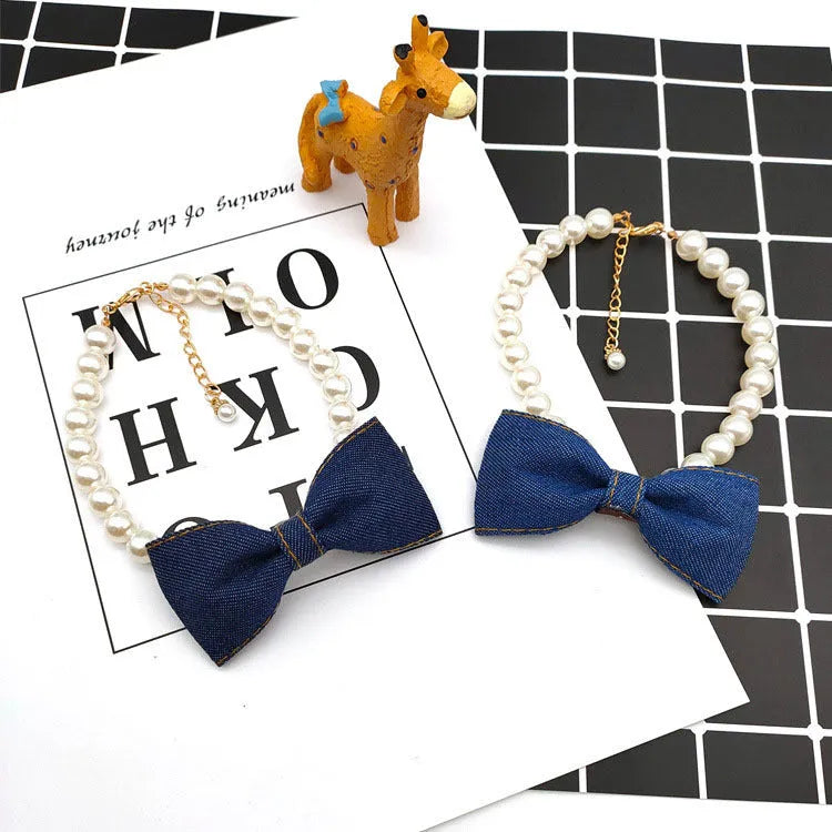 Pet necklace with denim bow and pearl pendant on a metal chain for cats and dogs in princess-style bib