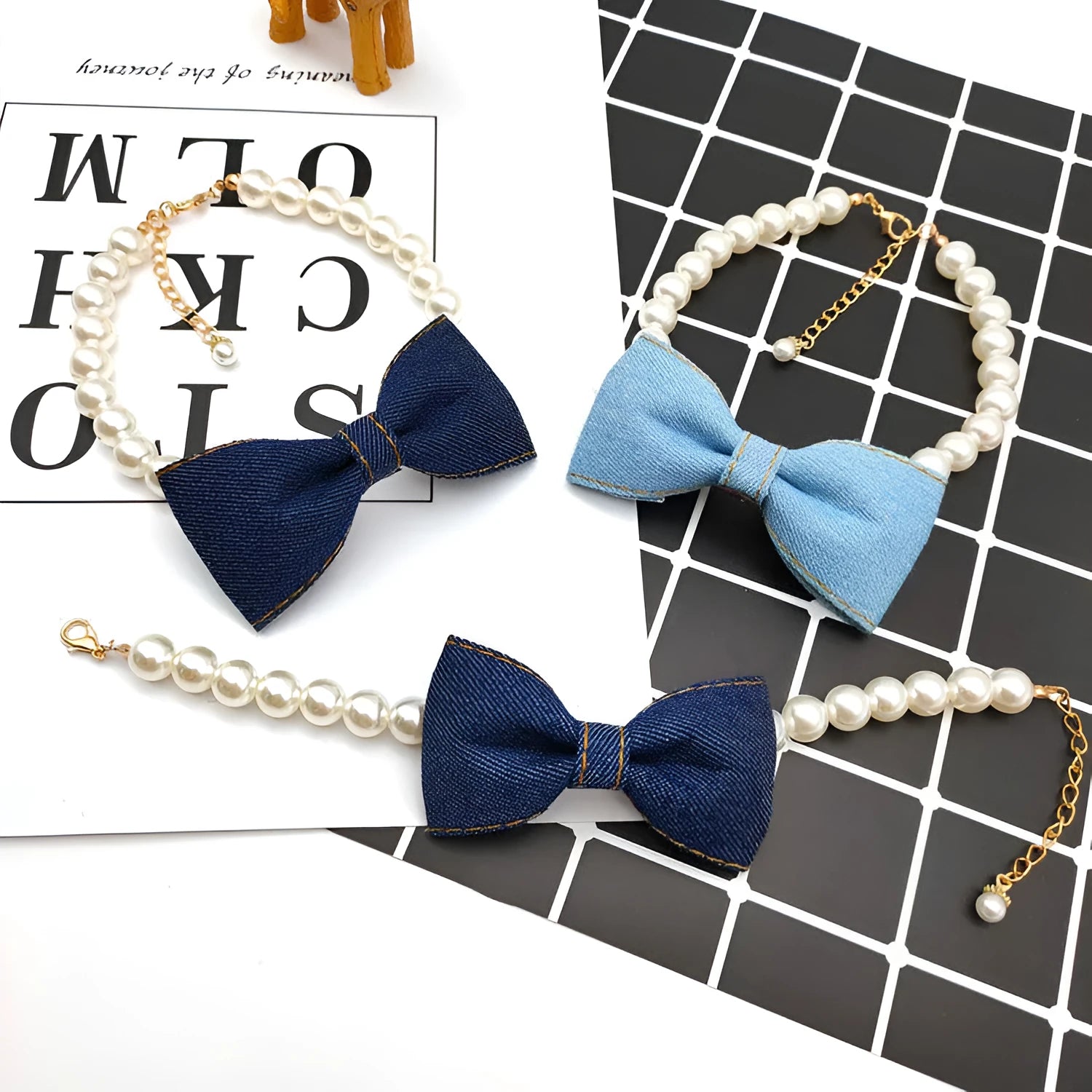 Pet necklace with denim bow and pearl pendant on a metal chain for cats and dogs in princess-style bib