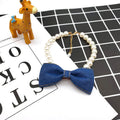 Pet necklace with denim bow and pearl pendant on a metal chain for cats and dogs in princess-style bib