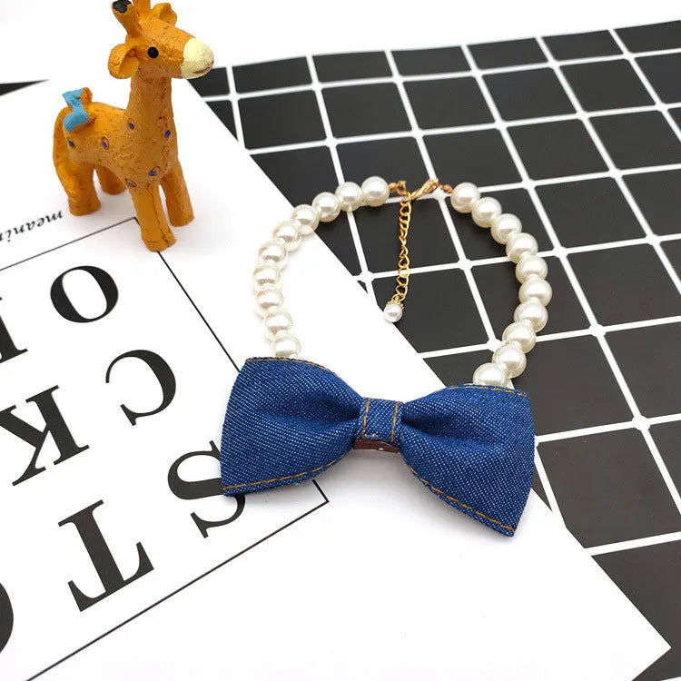 Pet necklace with denim bow and pearl pendant on a metal chain for cats and dogs in princess-style bib