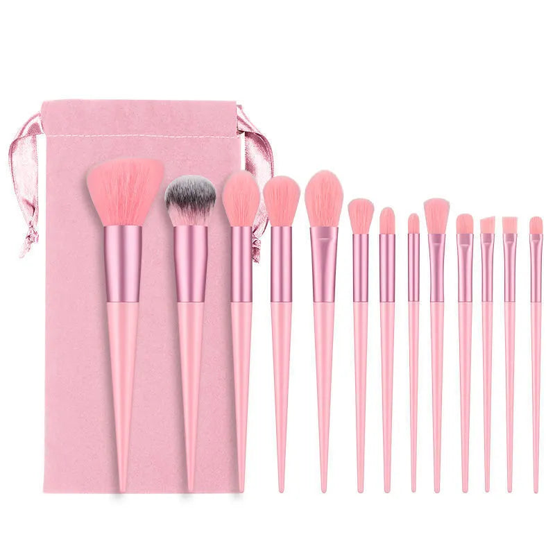 13-piece Wizard of Oz green makeup brush set with man-made fibre bristles and wooden handles in cloth bag