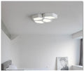 Geometric shaped LED panel ceiling light in black or white iron frame, remote control included.