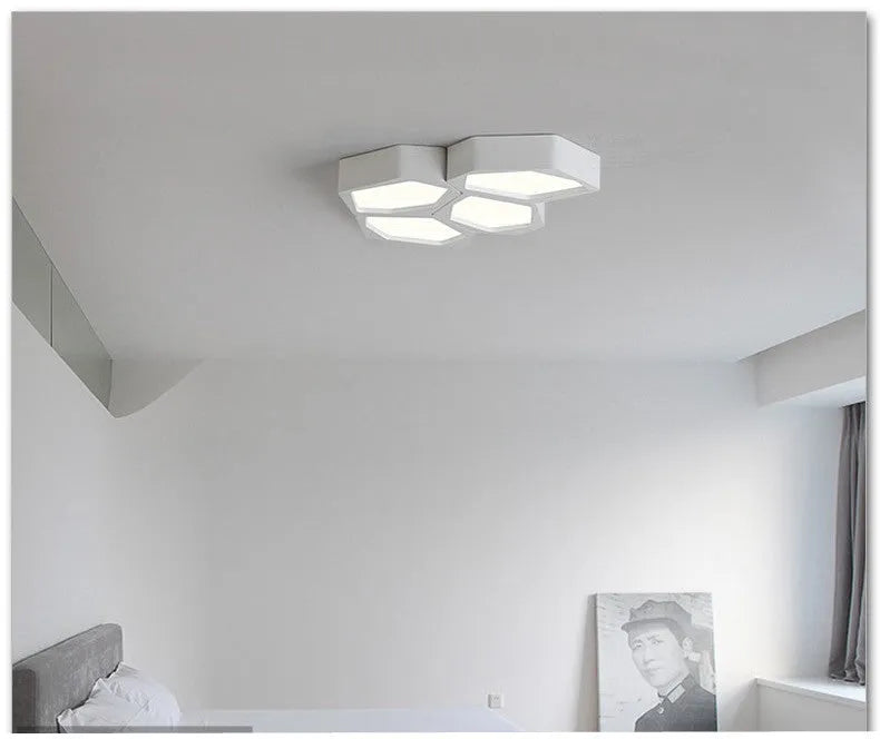 Geometric shaped LED panel ceiling light in black or white iron frame, remote control included.