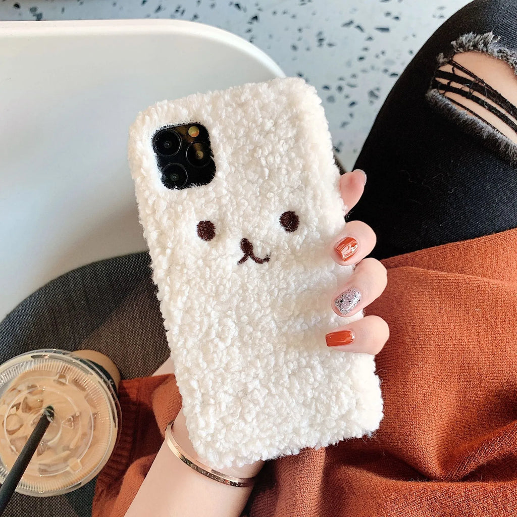 Soft TPU iPhone case with embroidered cartoon bear face in brown and white colour options