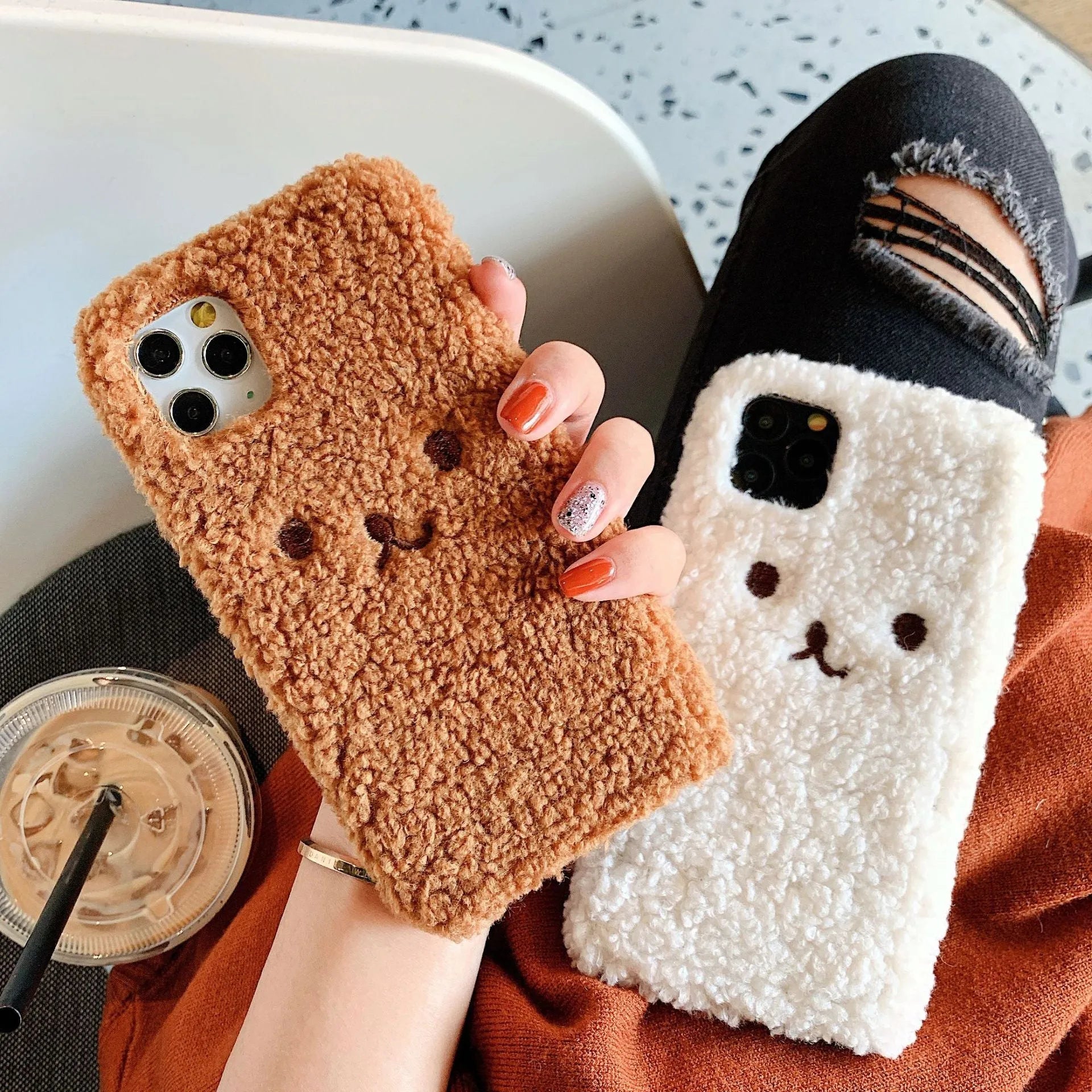 Soft TPU iPhone case with embroidered cartoon bear face in brown and white colour options