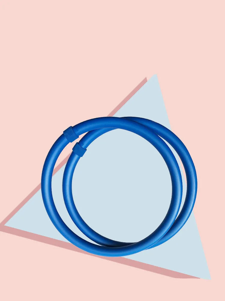 Pair of blue and pink arm massage hoops with stainless steel wire core and soft foam grip, 36x30x60cm