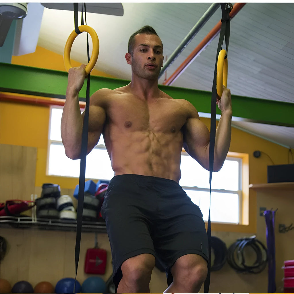 Black rubber encapsulation gymnastics training rings with ropes and gloves for indoor pull-ups and stretching exercise
