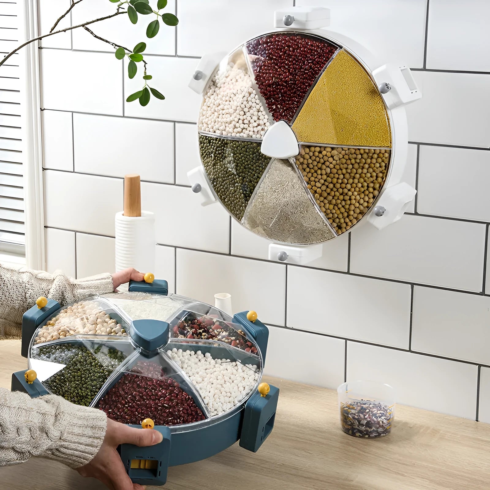 Wall-mounted rotating grain dispenser with six compartments, blue-yellow colour, press-button dispenser and clear PC top cover