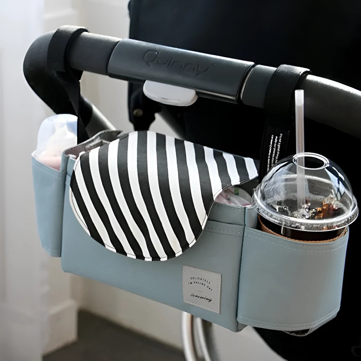 Oxford cloth hanging mommy bag with 20-35L capacity for car baby storage, in black, dark gray, sky blue, and pink tassels colours