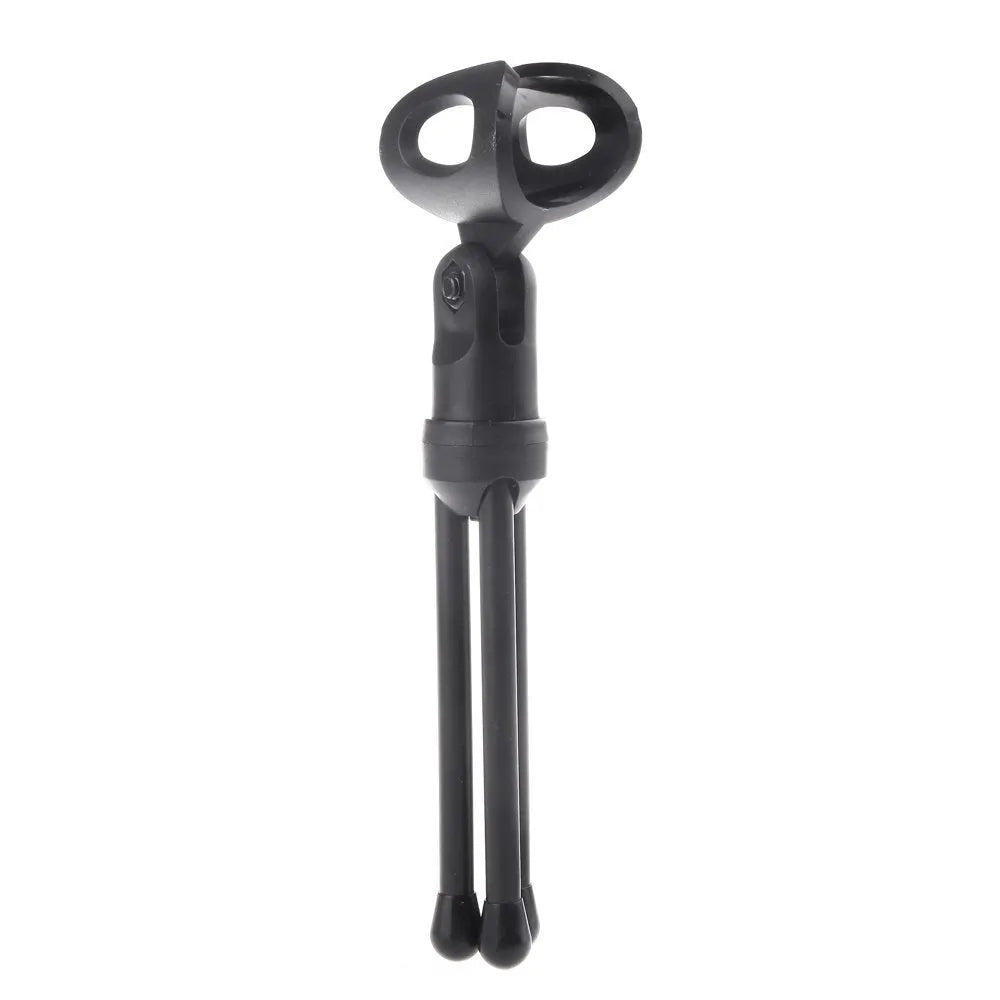 Black wired PC microphone with adjustable metal clip and separate desk mounting bracket on a white background