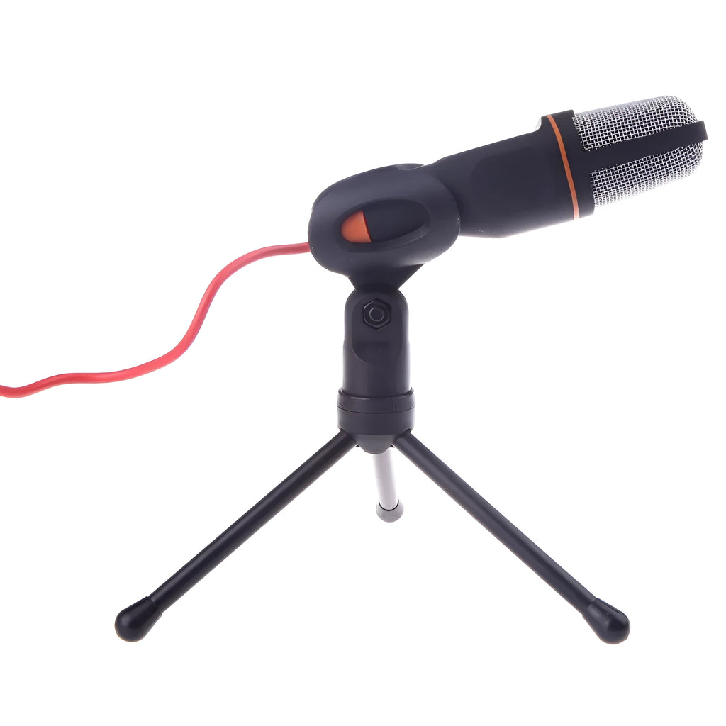 Black wired PC microphone with adjustable metal clip and separate desk mounting bracket on a white background