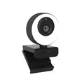 Black 1080p USB webcam on a desk with its magnetic privacy cover attached, showing the 1.7 metre USB cable.