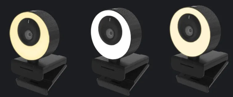 Black 1080p USB webcam on a desk with its magnetic privacy cover attached, showing the 1.7 metre USB cable.