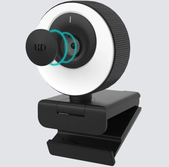 Black 1080p USB webcam on a desk with its magnetic privacy cover attached, showing the 1.7 metre USB cable.