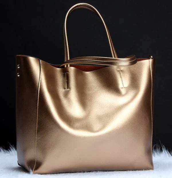 Women's structured cowhide leather shoulder bag shown in silver, with detachable strap.